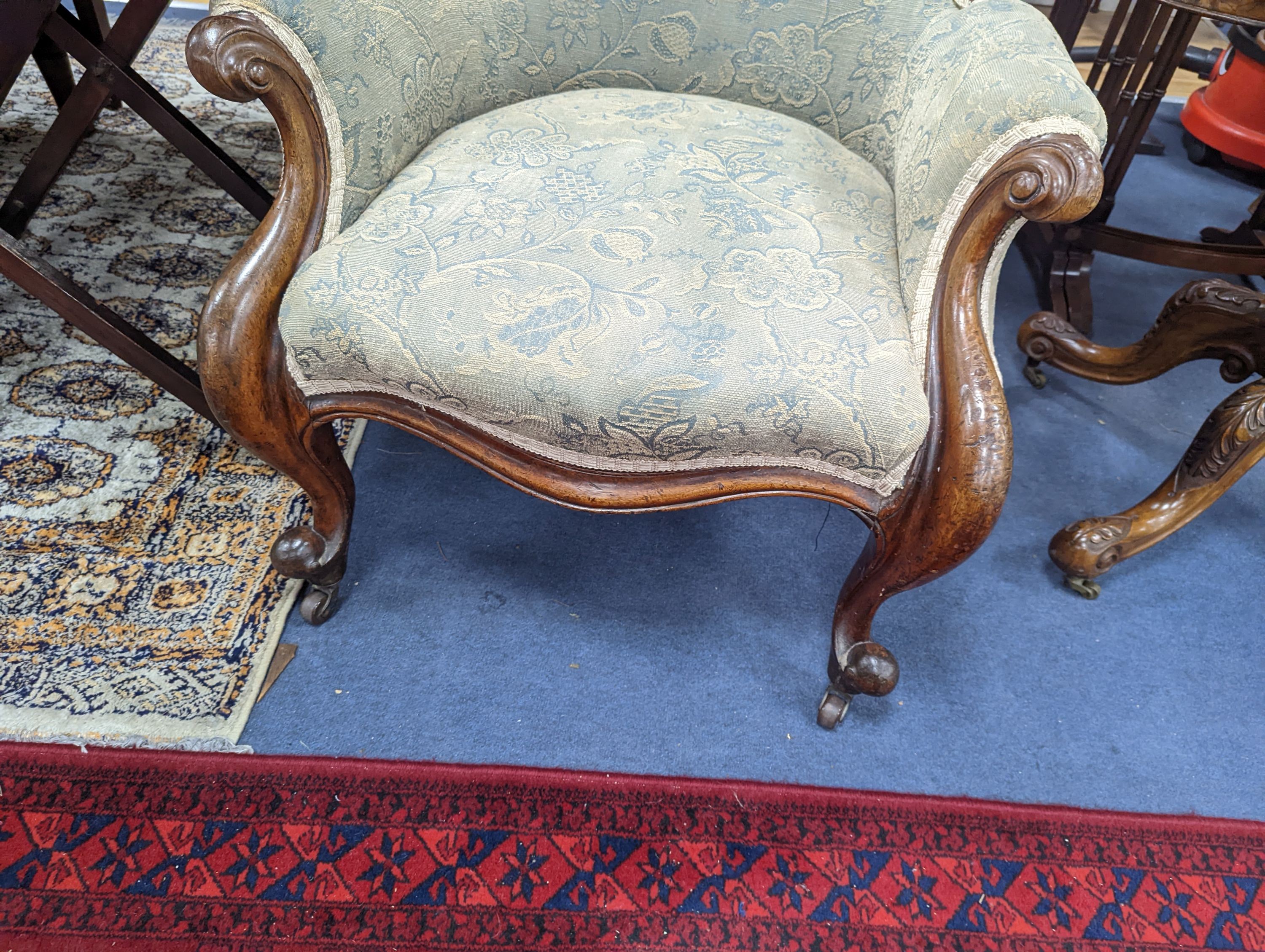 An upholstered Victorian armchair